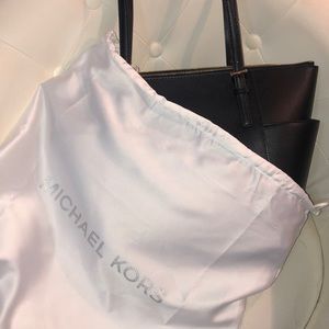 Brand new Michael Kors Bag and matching wallet.